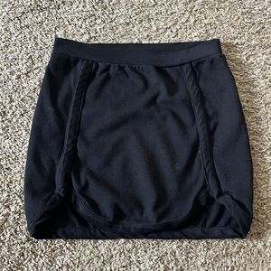 Lulu’s Solemio black mini skirt with curved edges